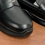 Prada unisex black leather loafer toe view with low profile rubber sole