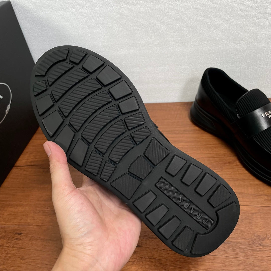 Prada unisex loafers outsole, black textured rubber tread with thick platform sole