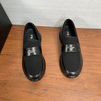 Prada unisex loafers, front and back view; black slip-on with ribbed elastic panels