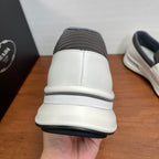 Back view of white slip-on sneakers with gray sock-like collar