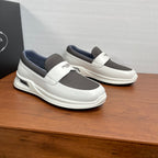 White slip-on sneakers with two-tone gray upper and thick rubber sole