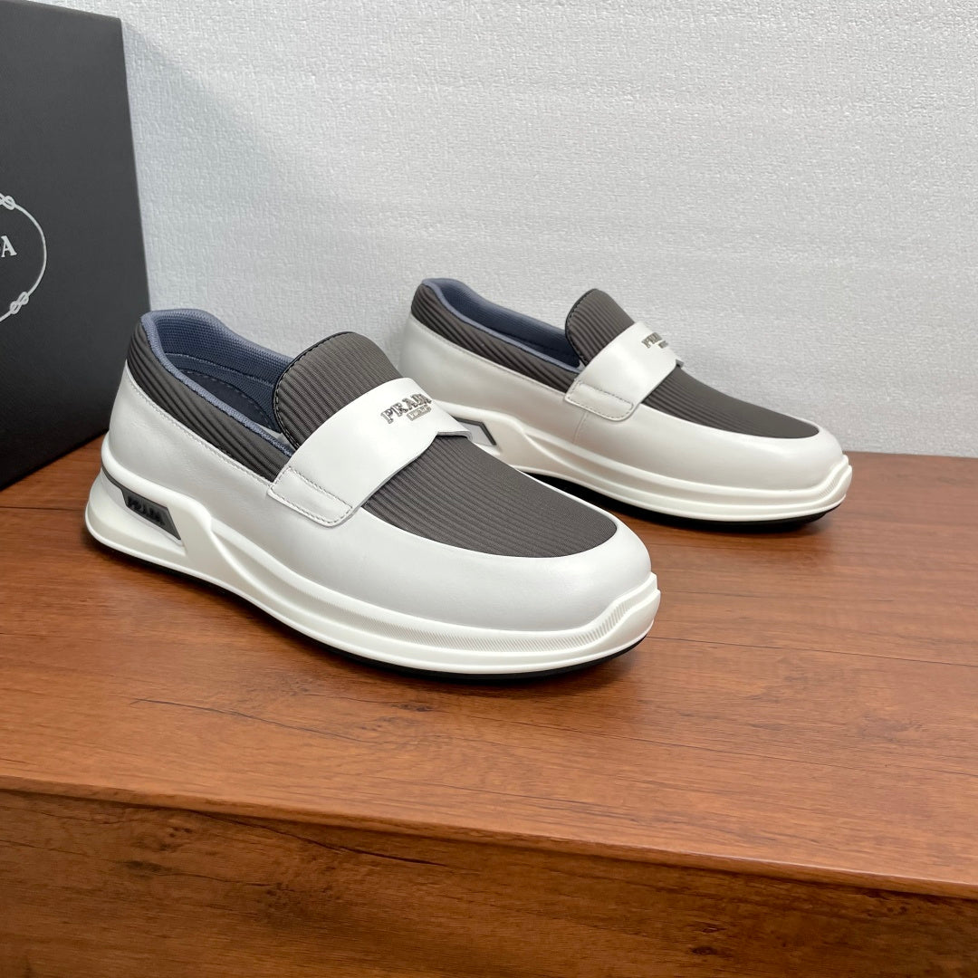 White slip-on sneakers with two-tone gray upper and thick rubber sole
