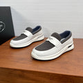 Prada white slip-on sneakers with gray elastic side panels and cushioned sole