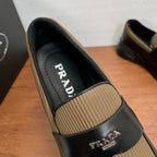 Prada unisex loafer with tan knit insert, black leather upper and PRADA label