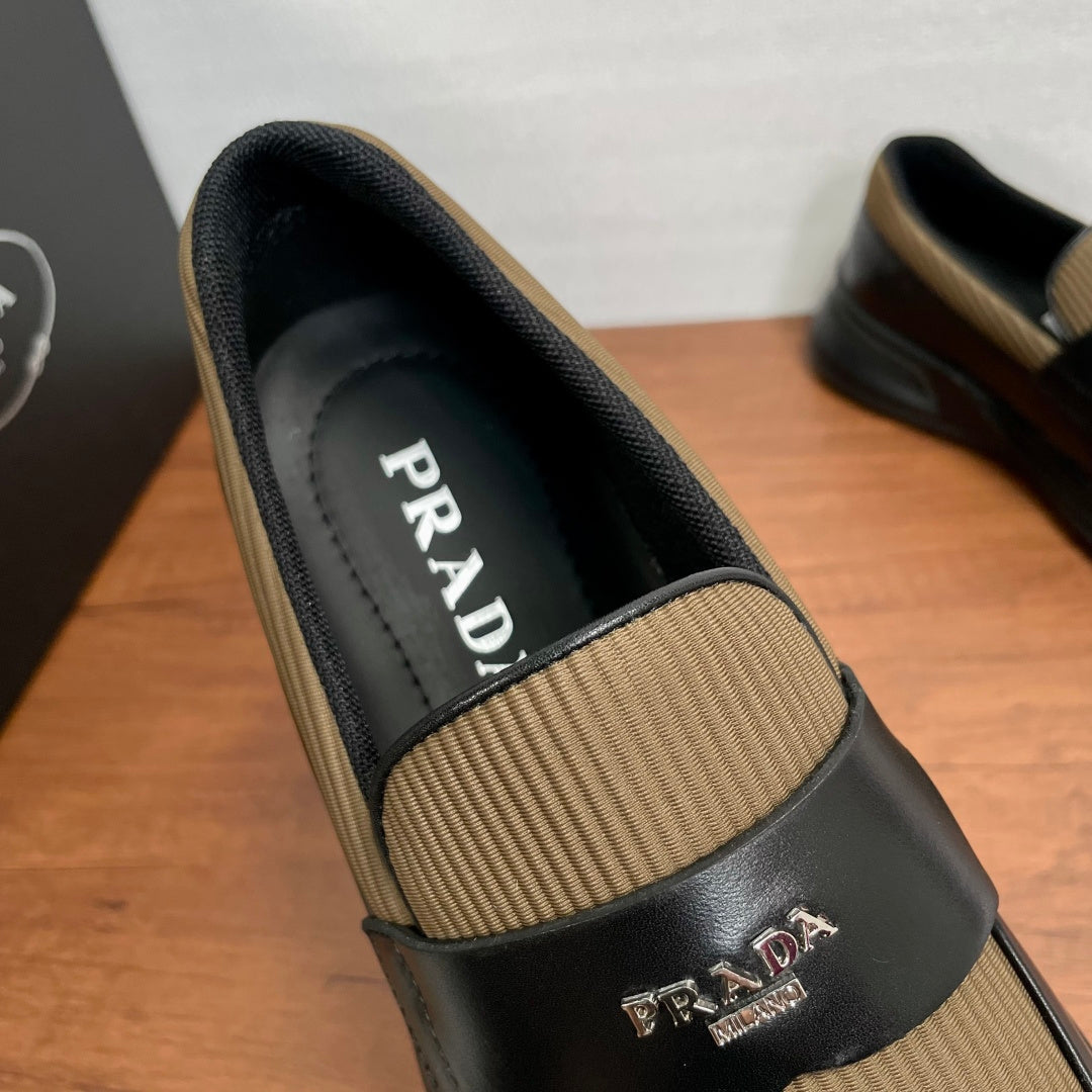 Prada unisex loafer with tan knit insert, black leather upper and PRADA label