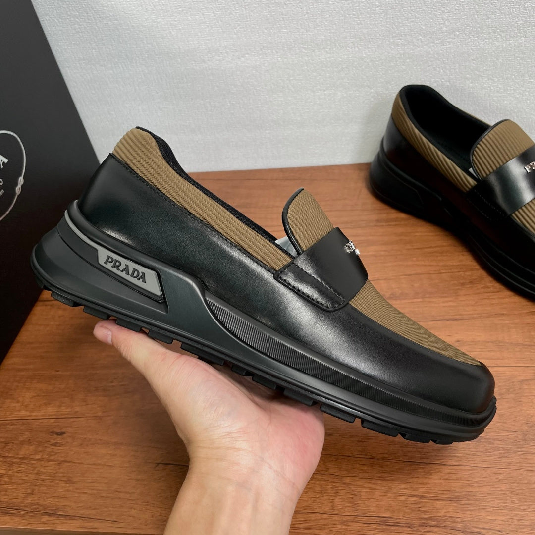 Prada unisex loafers with strap detail, black leather and tan knit trim