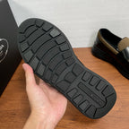 Prada unisex loafer outsole, black rubber tread with geometric traction pattern