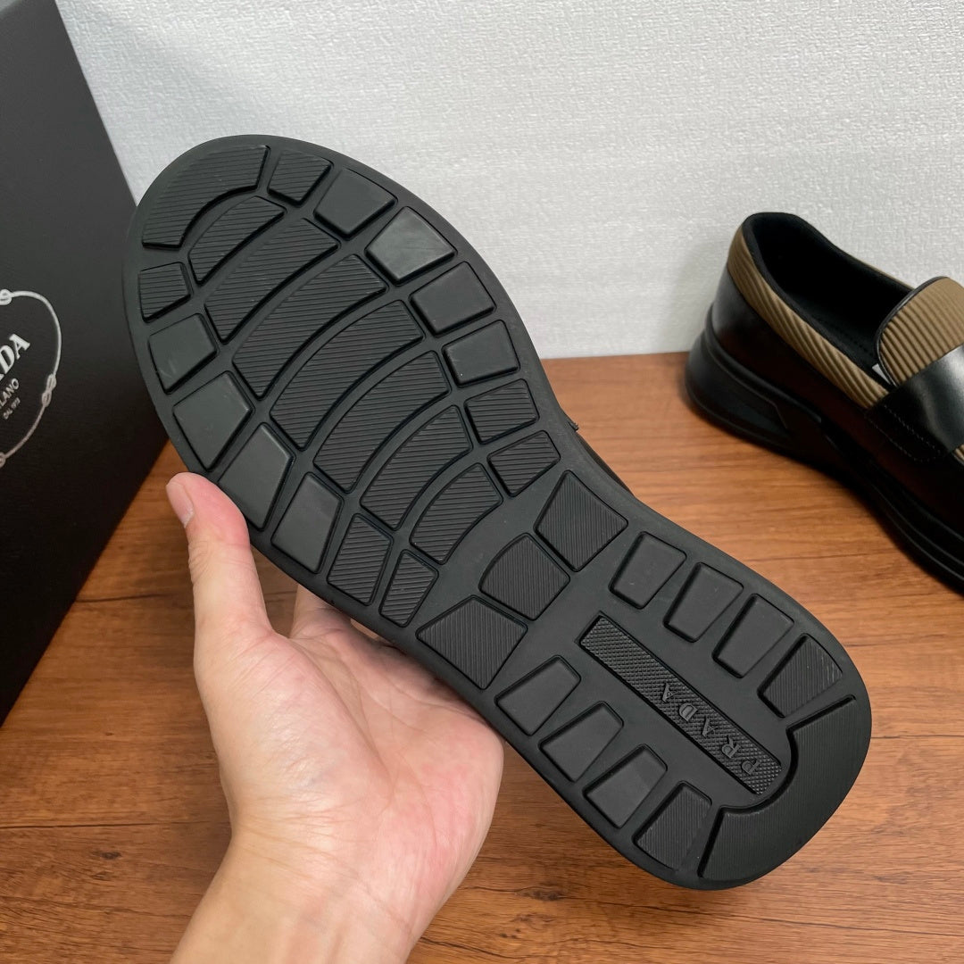 Prada unisex loafer outsole, black rubber tread with geometric traction pattern