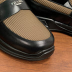 Prada unisex loafers toe detail, black leather vamp with tan knit insert and sole edge