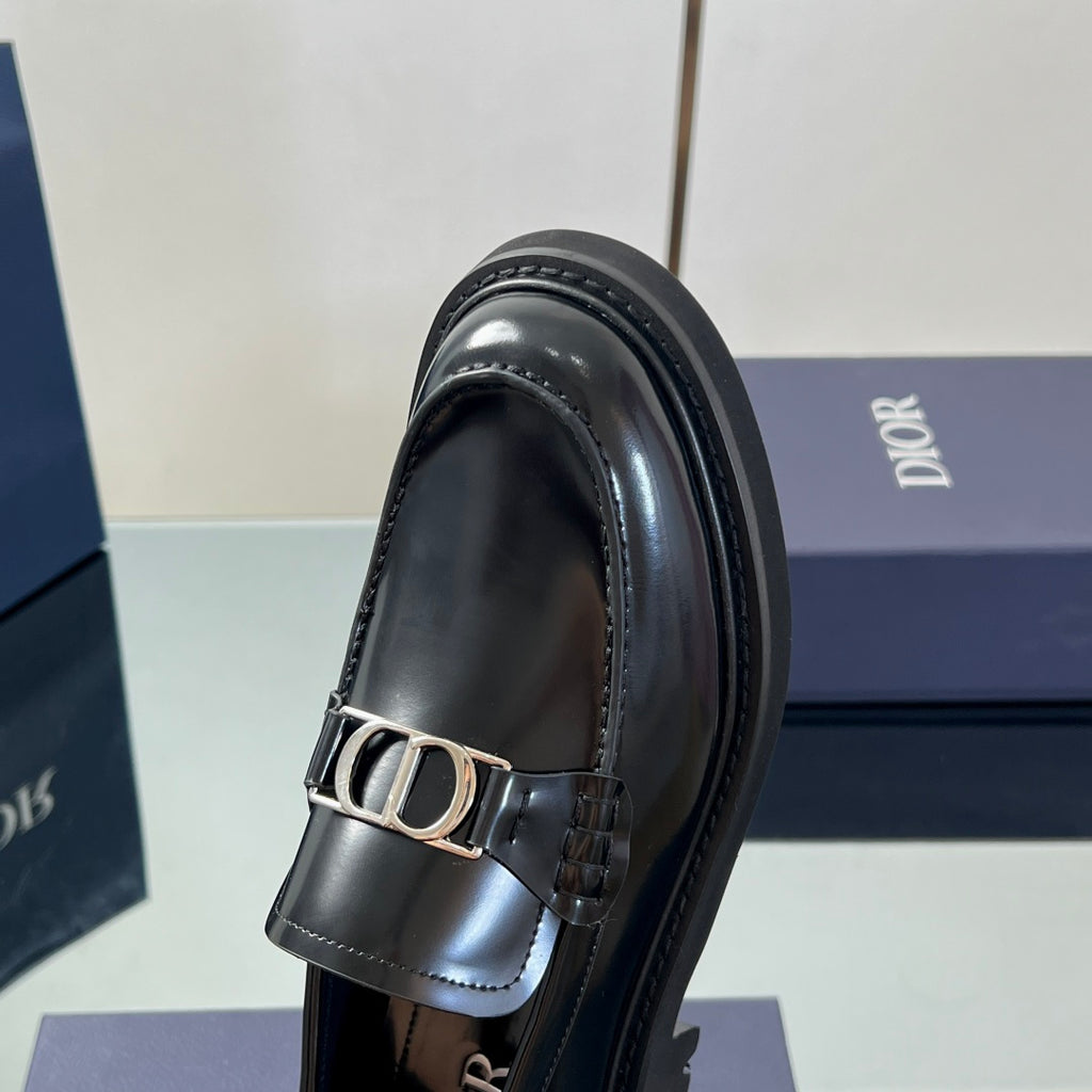 Black leather unisex loafer close-up of Dior buckle strap and stitching