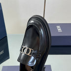 Black leather unisex loafer close-up of Dior buckle strap and stitching