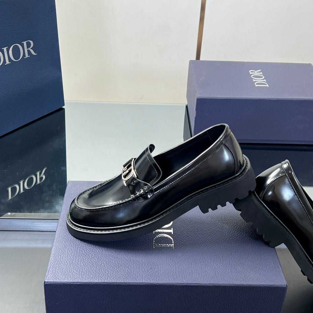 Black leather unisex loafer 3/4 view with Dior buckle strap and thick sole