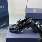 Black leather unisex loafer 3/4 view with Dior buckle strap and thick sole