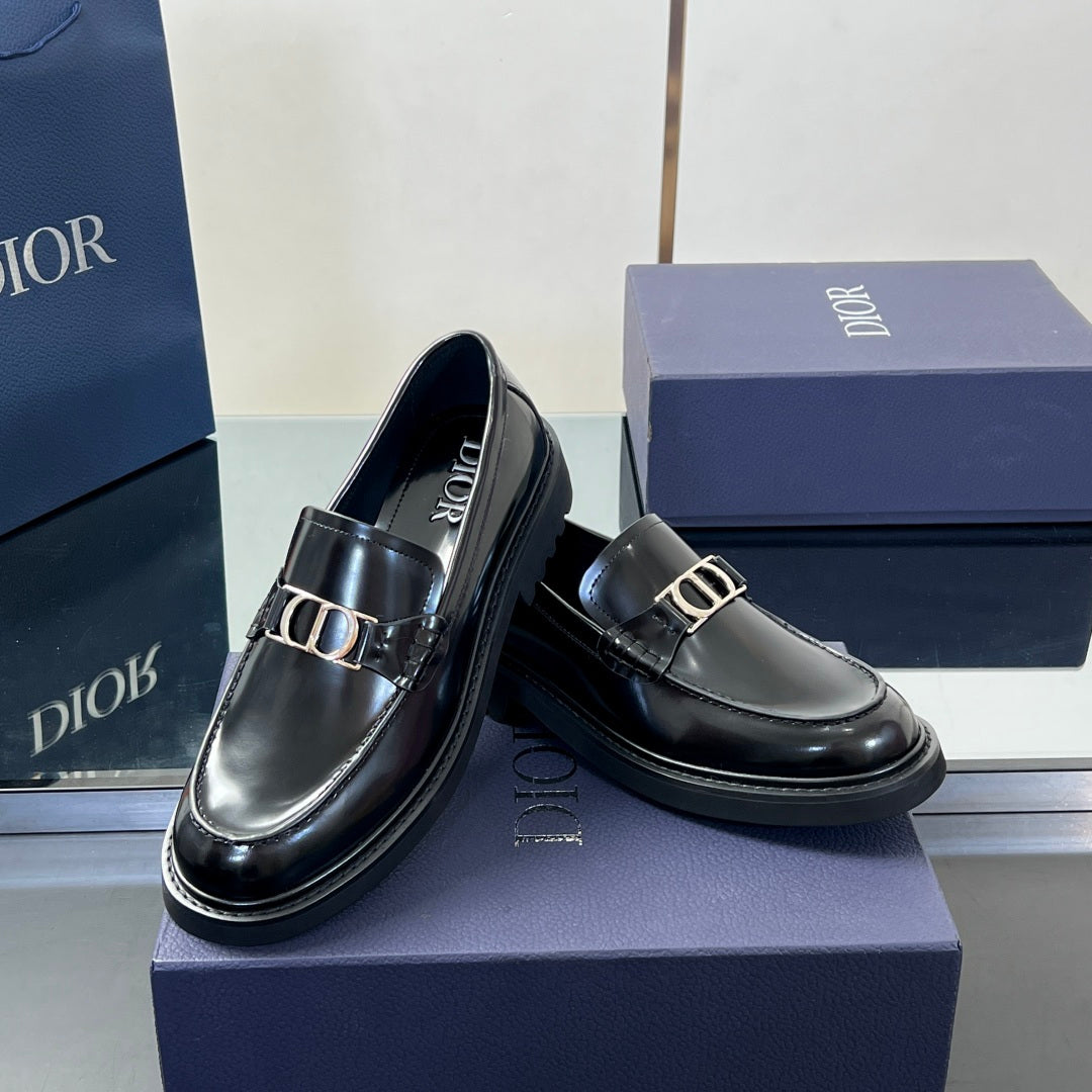 Black leather unisex loafer pair with Dior buckle and glossy finish