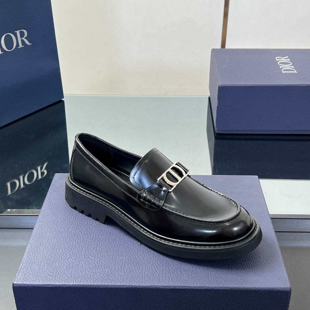 Black leather unisex loafer with buckle strap and rounded toe