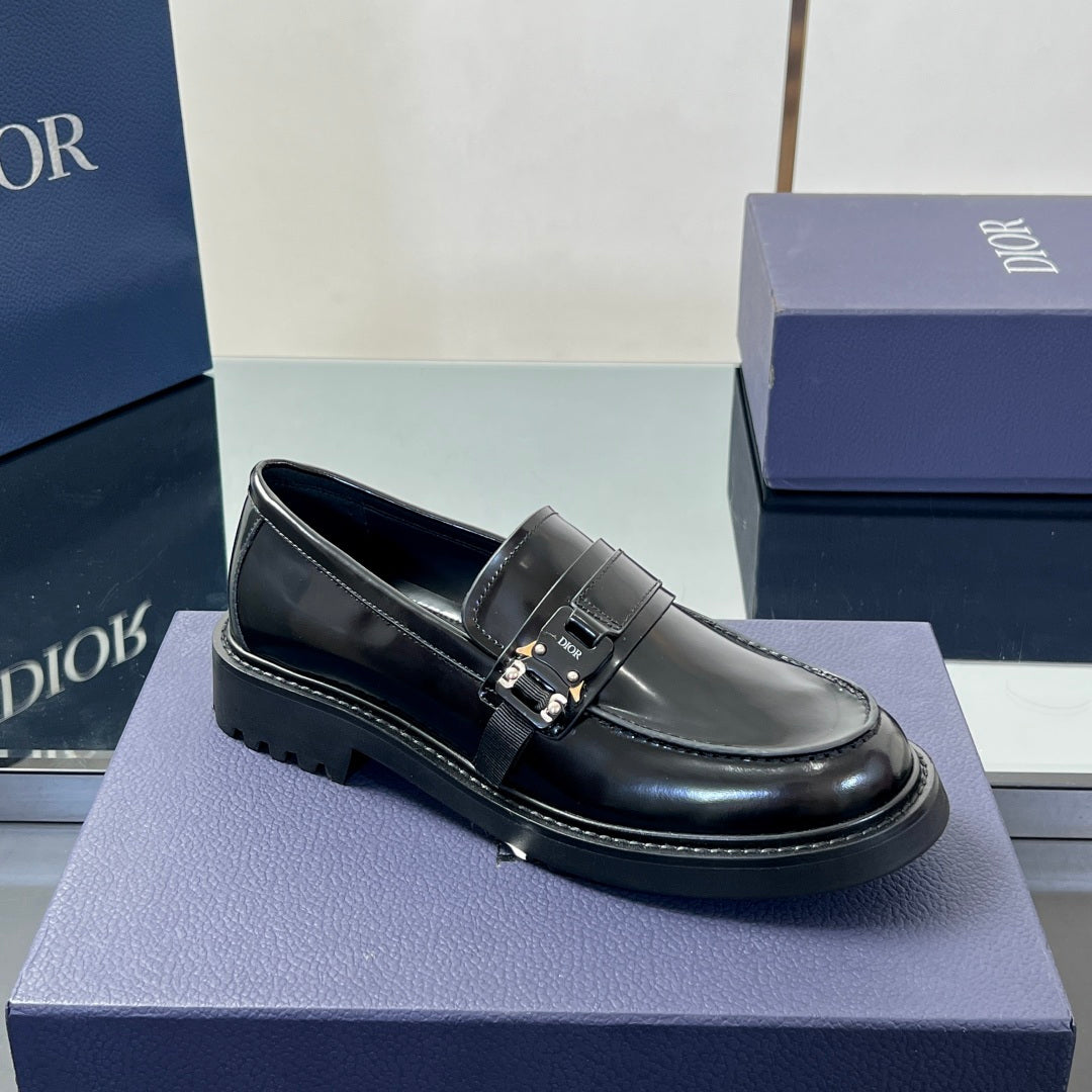 Black leather unisex loafer with front strap buckle and thick lug sole