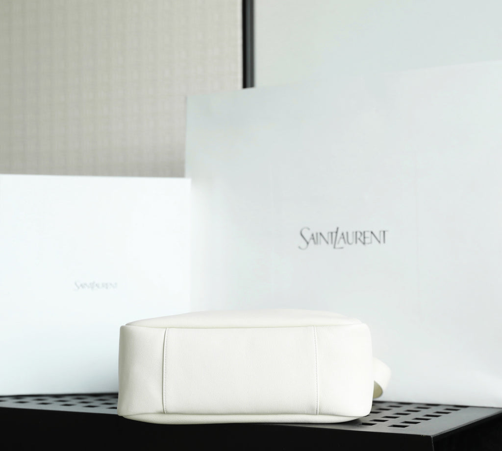 YSL bag white leather pouch style with embossed logo on front.