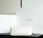YSL bag white leather pouch style with embossed logo on front.