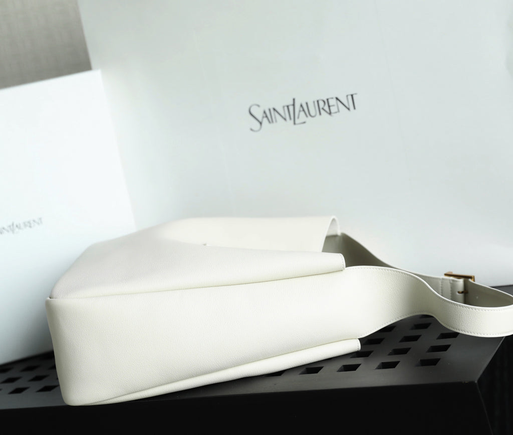 YSL bag white leather with smooth base and white strap handle.