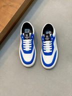 Blue and white low-top lace-up sneakers, pair side view with logo on heel and tongue