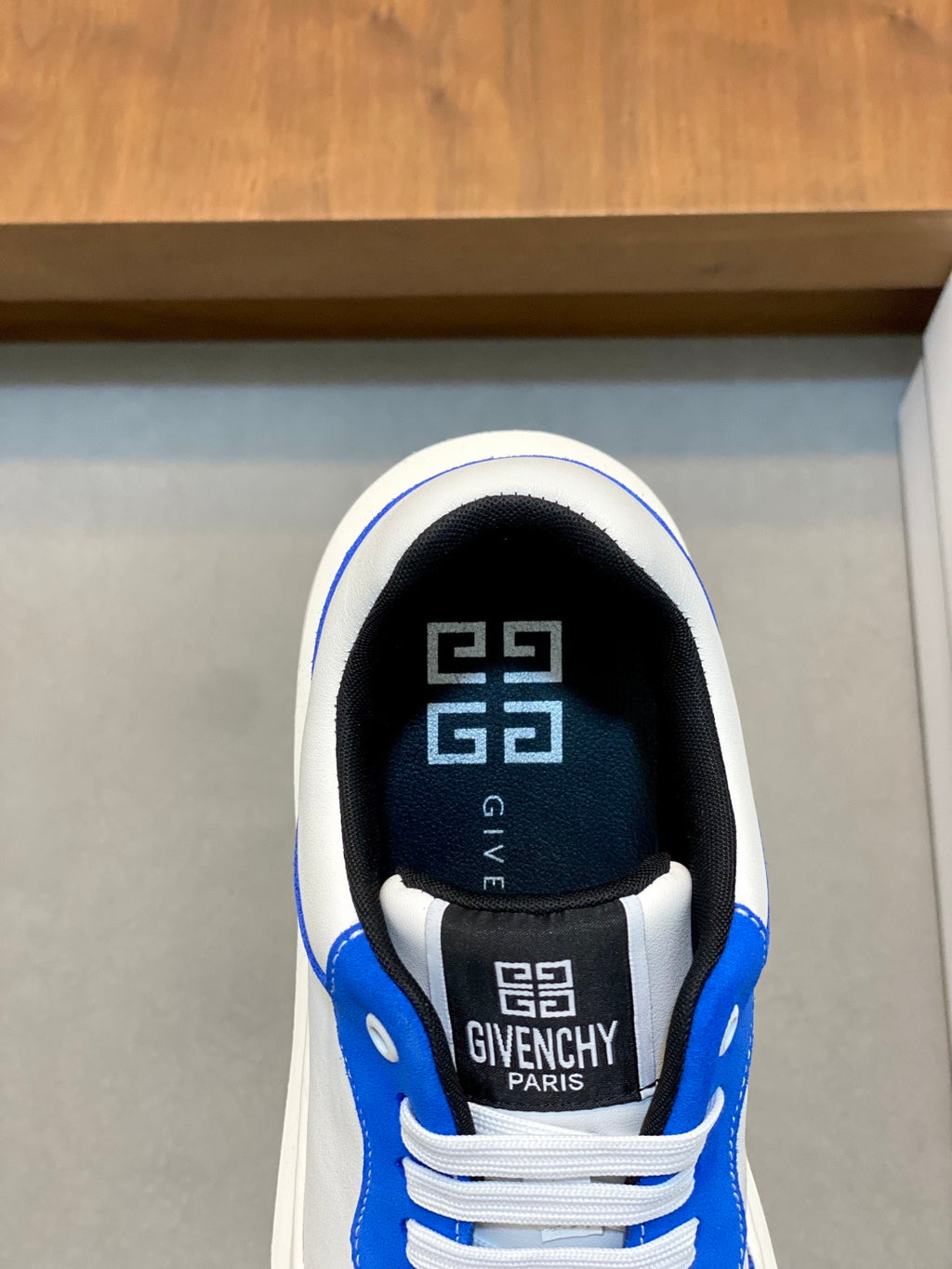 Blue and white low-top sneaker inner lining and tongue with GIVENCHY logo