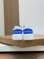 Blue and white low-top sneakers, rear view with blue heel tabs and GIVENCHY lettering