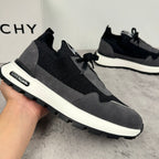 Black and dark gray lace-up sneakers with white sole and side brand patch