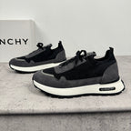 Dark lace-up sneakers with black upper, gray panels, and white sole