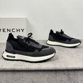 Black and dark gray mesh sneakers with white sole and lace-up front