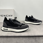 Black and dark gray mesh sneakers with white sole and lace-up front