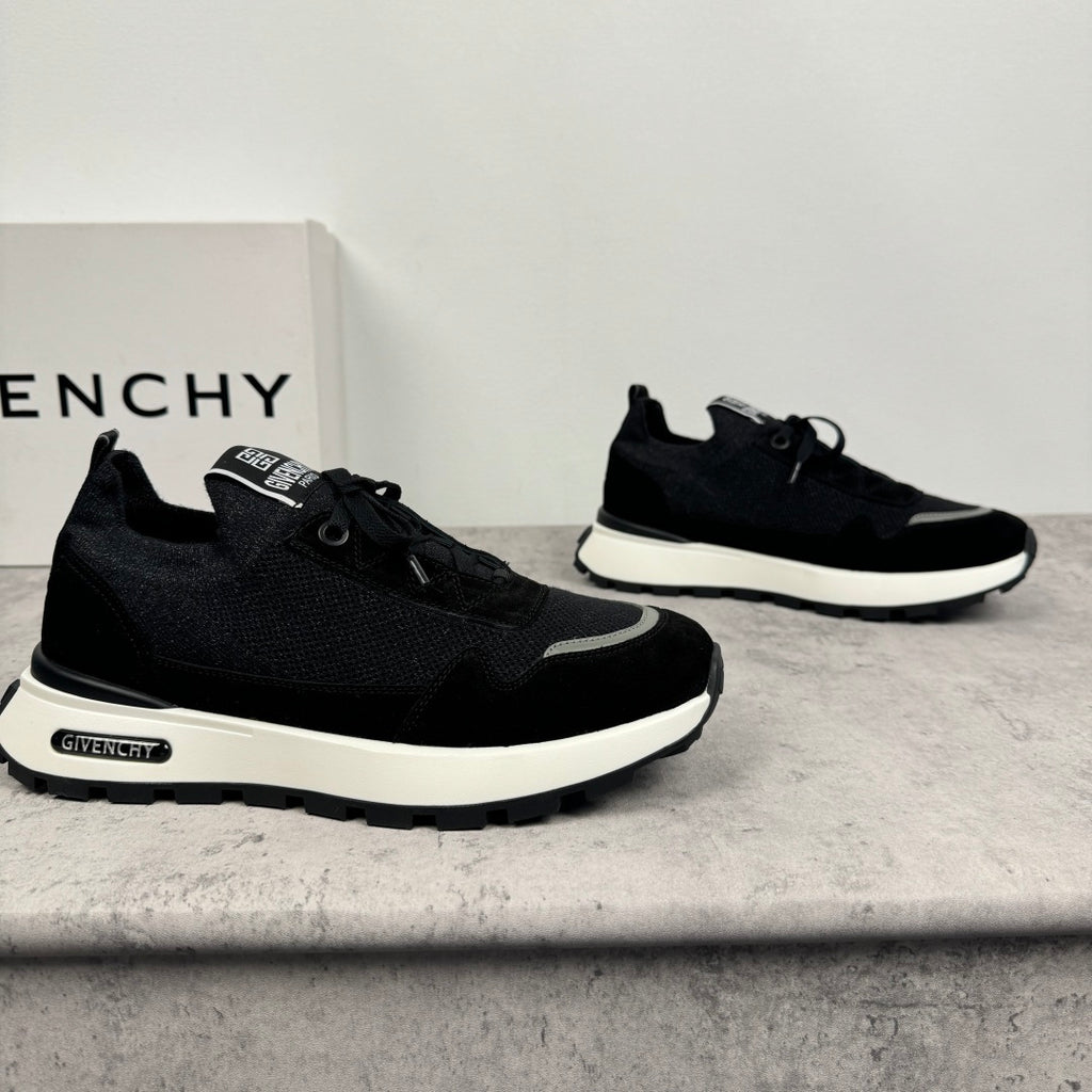 Black Givenchy low-top sneakers with lace-up front and chunky white sole