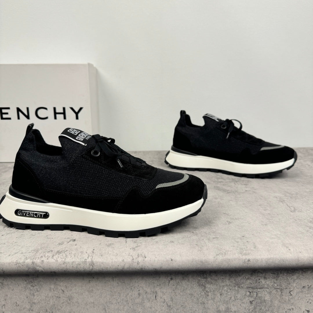 Black Givenchy low-top sneakers with lace-up front and chunky white sole