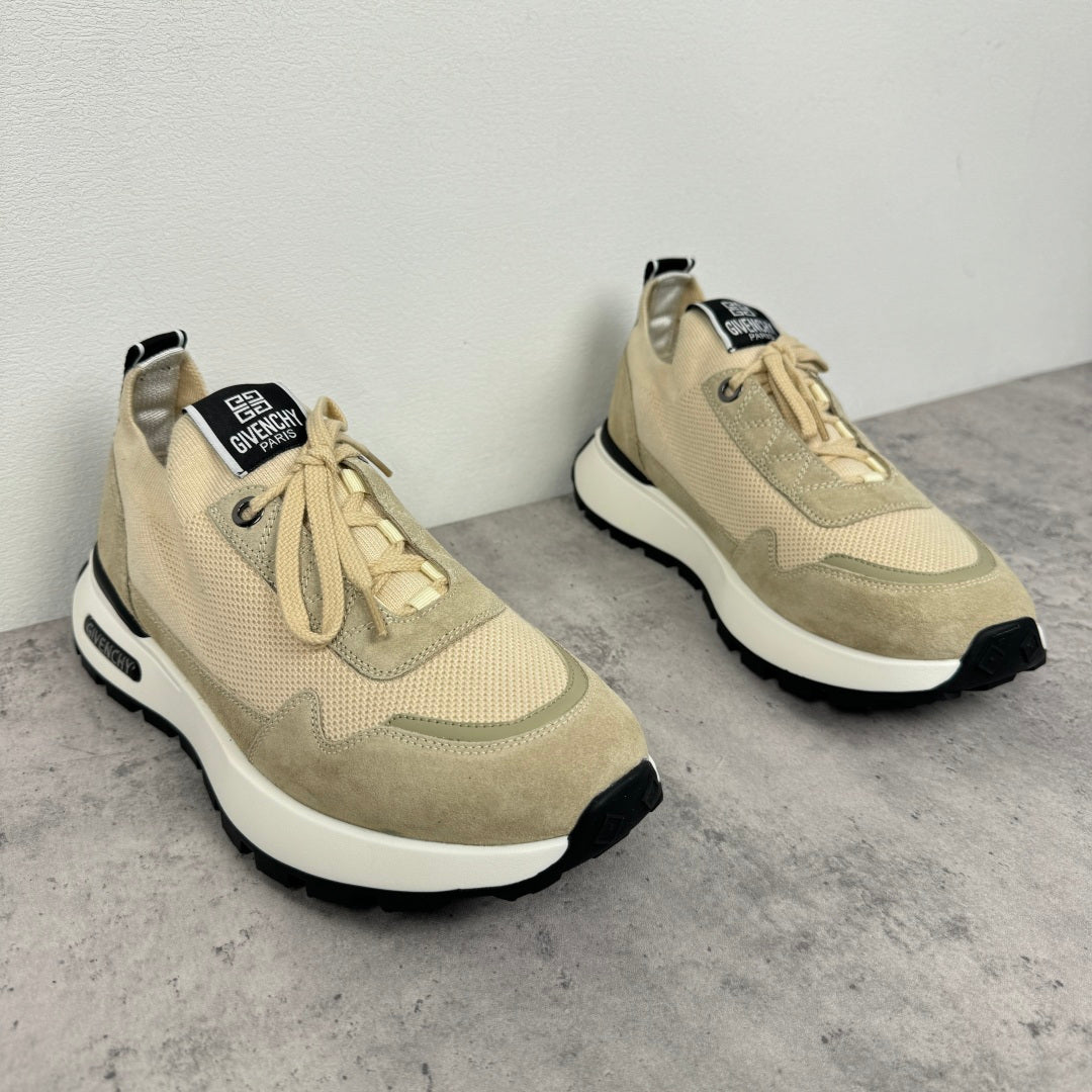 Givenchy luxury shoes, tan lace-up sneakers with black-and-white sole, angled pair