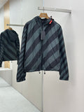 Hooded windbreaker jacket with diagonal striped pattern in dark blue and light blue