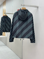 Hooded windbreaker jacket with diagonal stripes; front zipper and drawstring hem