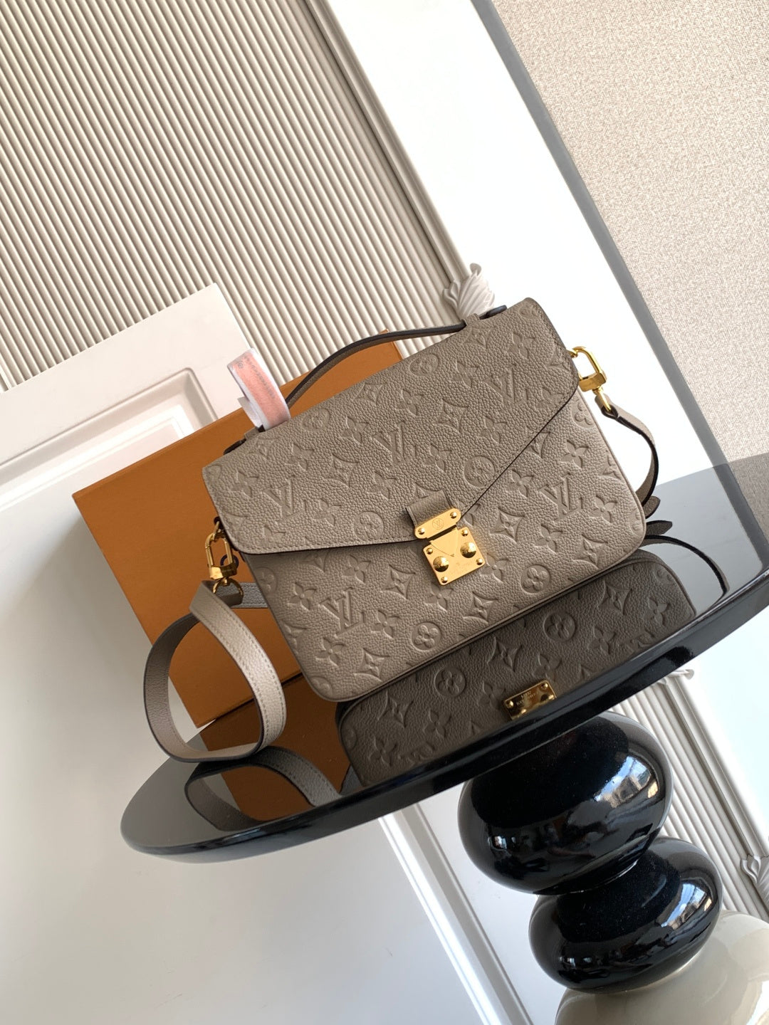 Louis Vuitton monogram crossbody bag in taupe with gold hardware and adjustable strap