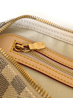 Louis Vuitton checkerboard bag zipper close-up with leather pull and gold teeth