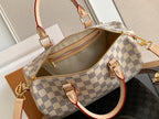Louis Vuitton checkerboard zip-top bag with tan interior and leather handles
