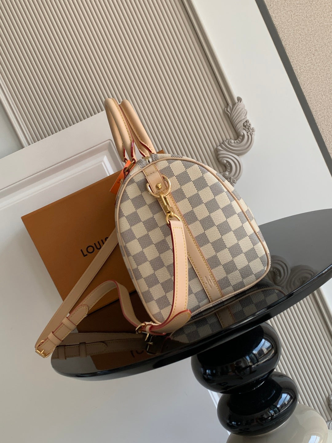 Louis Vuitton checkerboard bag with backpack-style straps and tan leather trim