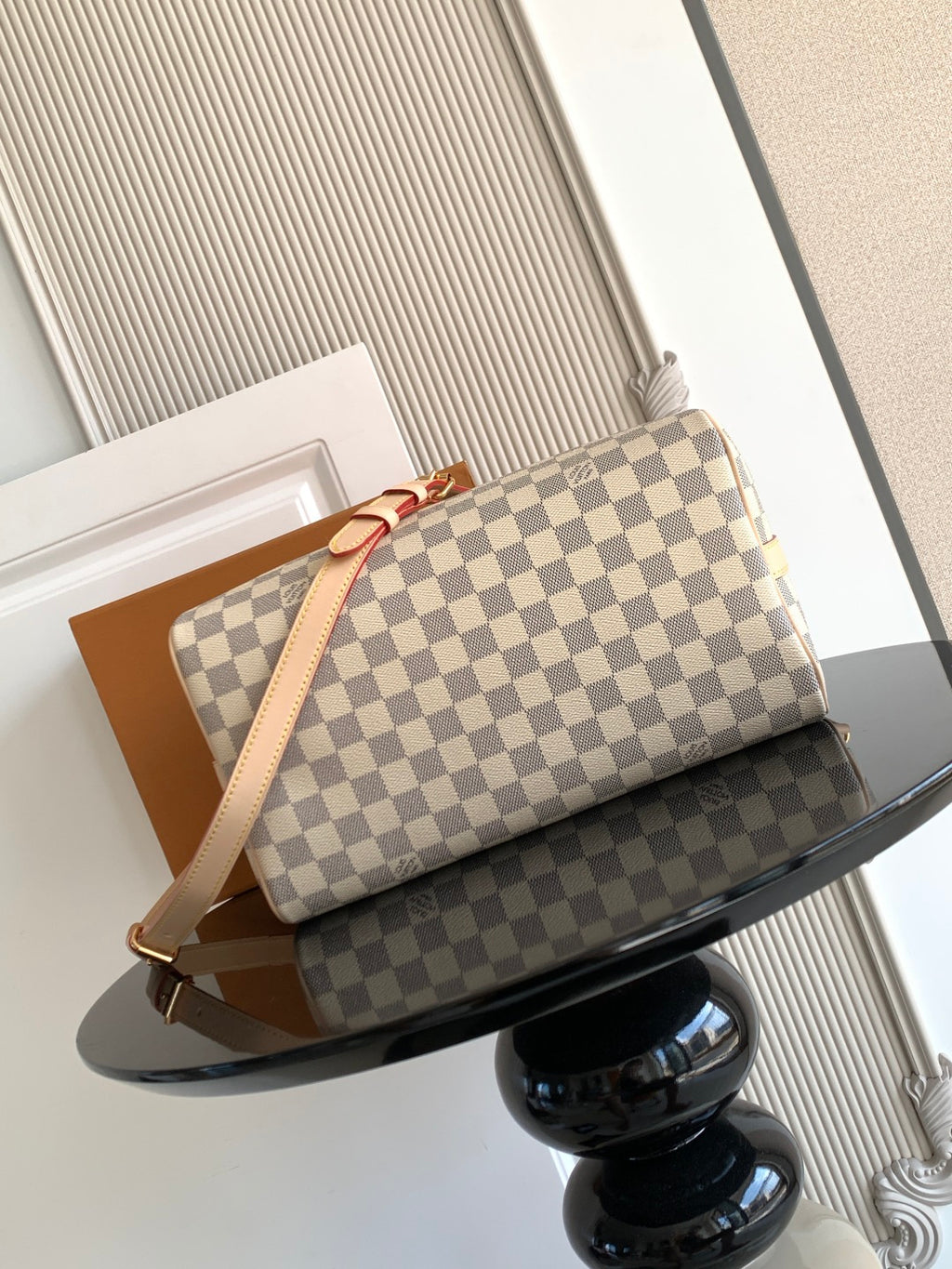 Louis Vuitton checkerboard shoulder bag with long strap and gold-tone hardware