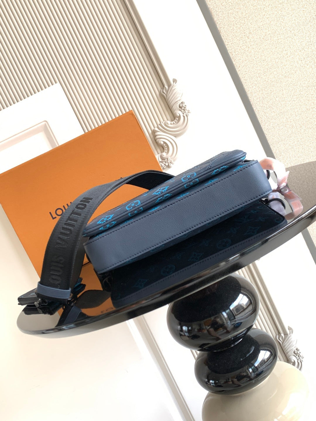 Louis Vuitton blue monogram bag with structured top and front strap
