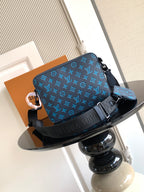 Louis Vuitton blue monogram shoulder bag with adjustable strap and flap closure