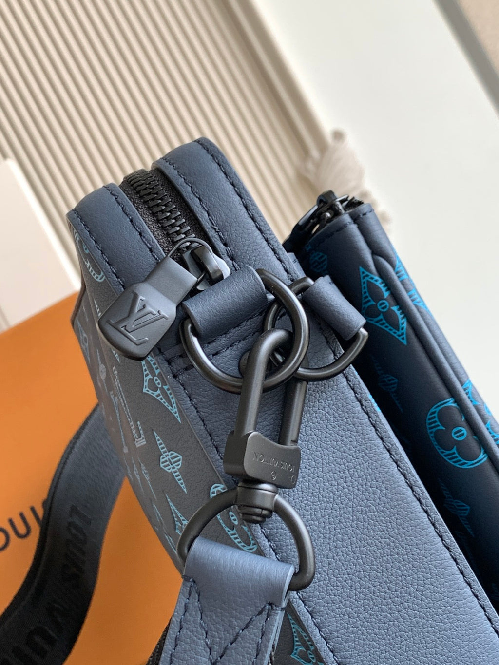 Louis Vuitton blue monogram bag with metal rings and clasp on strap