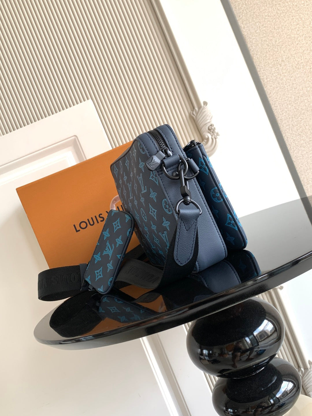 Louis Vuitton blue monogram crossbody bag with front buckle and shoulder strap