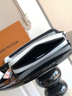 Crossbody bag zipper close-up with light blue trim and black main compartment