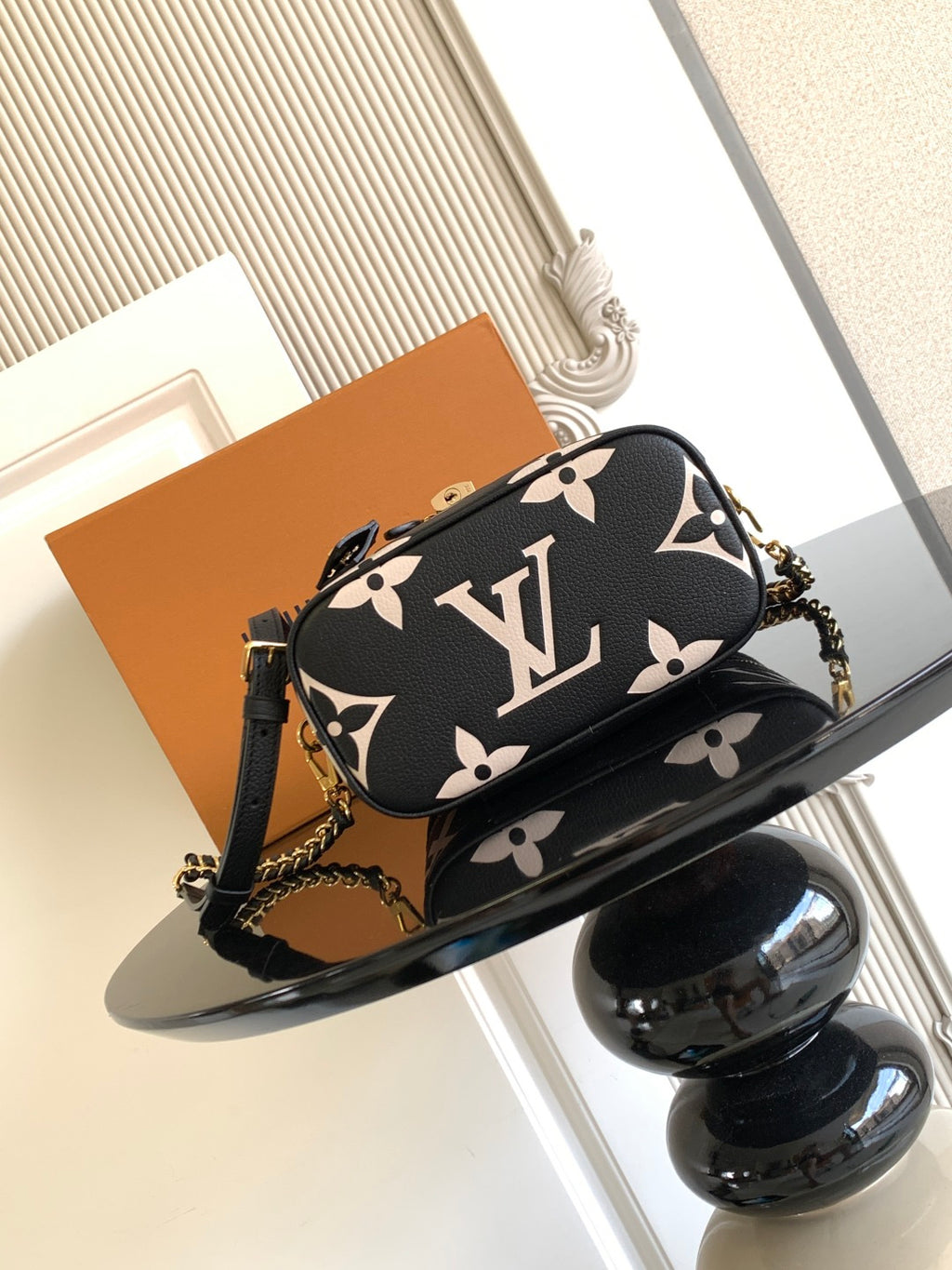 Louis Vuitton mini crossbody bag in black with white monogram and gold chain strap