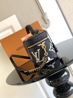 Louis Vuitton mini crossbody bag in black with white monogram, gold zipper and chain