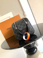 Louis Vuitton crossbody bag with dark Damier check pattern, top handle and strap