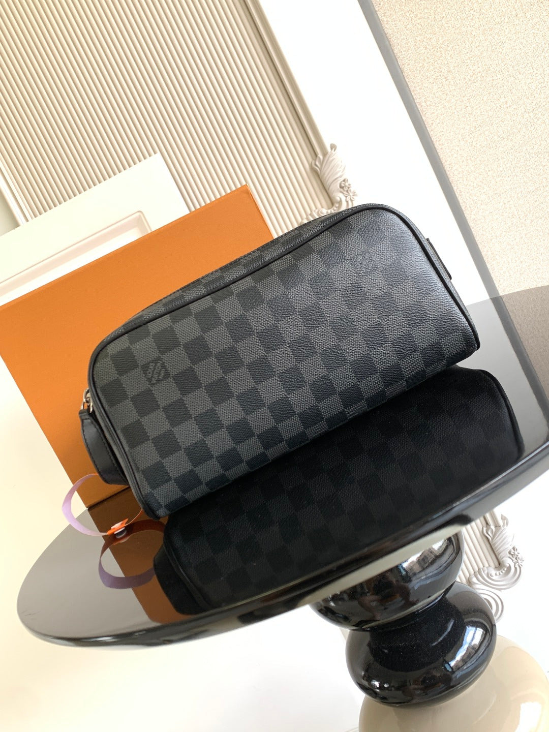 Louis Vuitton crossbody bag with dark Damier checkered canvas and black leather trim