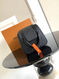 Louis Vuitton bag with dark monogram texture, top zipper, and orange tag